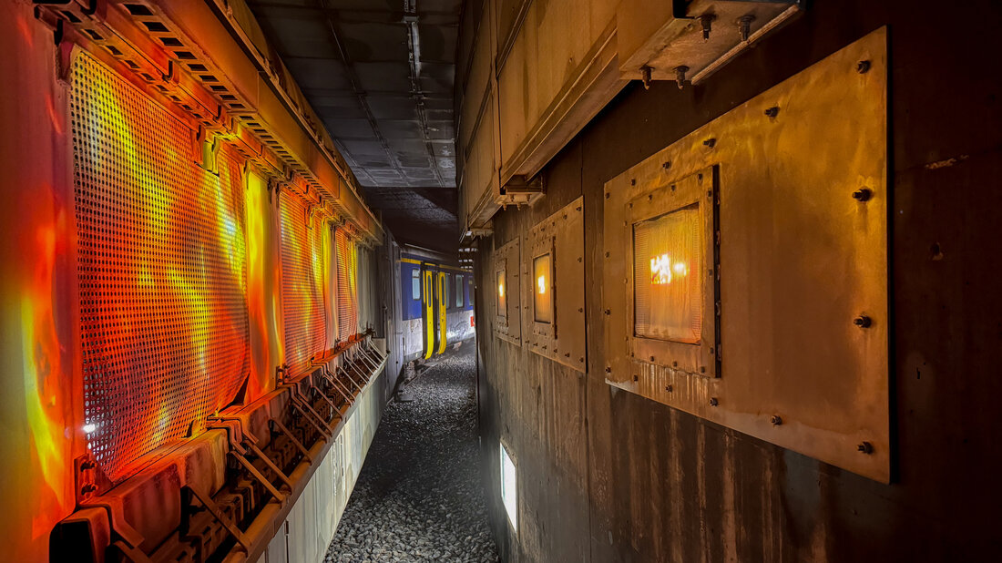 Projectors create the impression of flames on a railway car