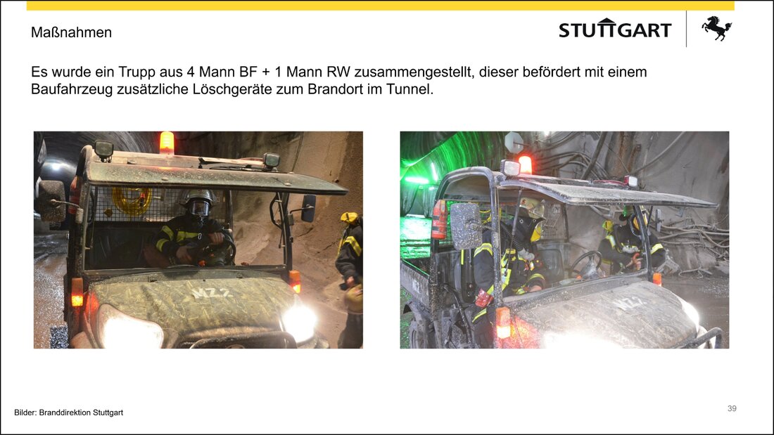 Feuerwehrangehörige bringen Löschgeräte zur Brandstelle