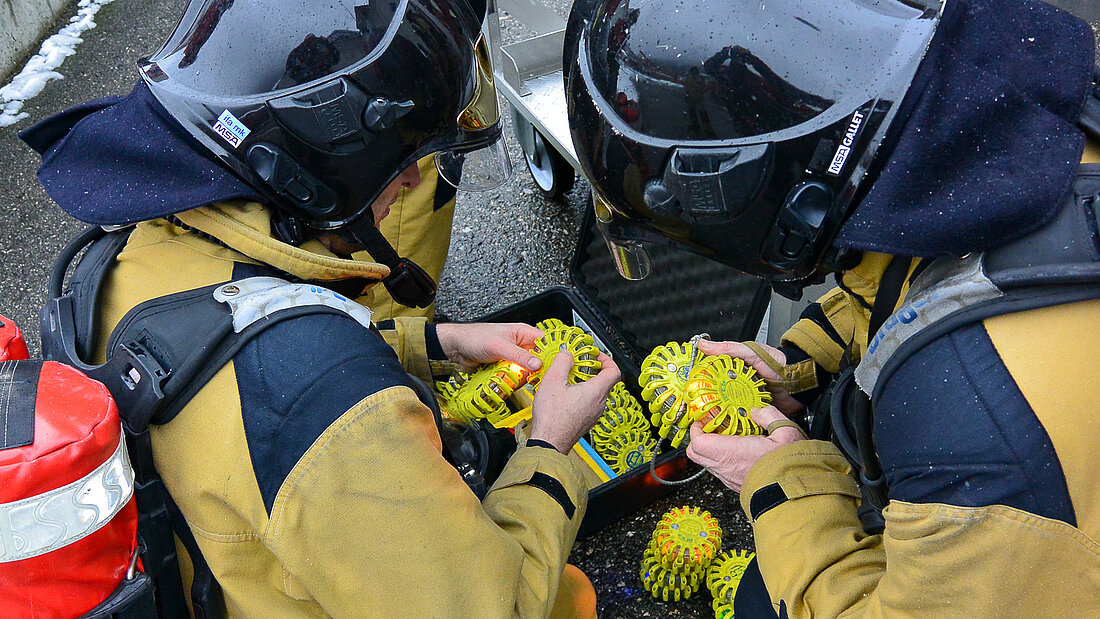 Marking lights Firefighters activate marking lights for use in a tunnel fire drill